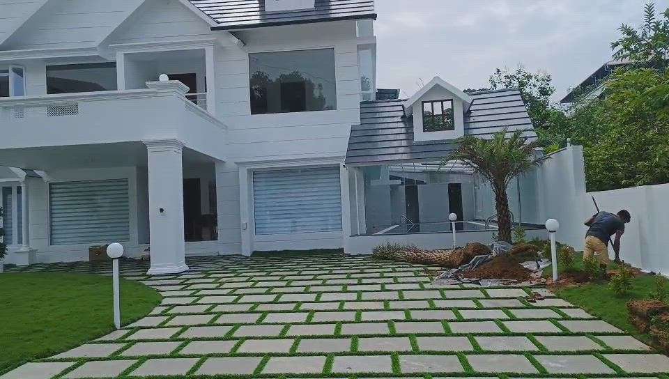 Natural stone paving with mexican grass, date pal plantation finishing stage client Mr. Thaha ernamkulam. contact abiya garden for beautiful landscape.