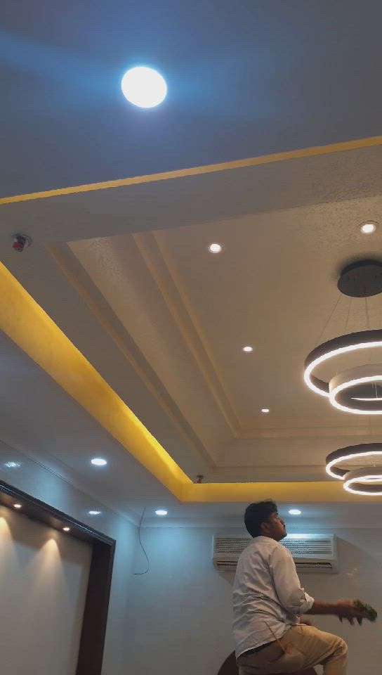 false ceiling design with stucco paint with warm light effect..