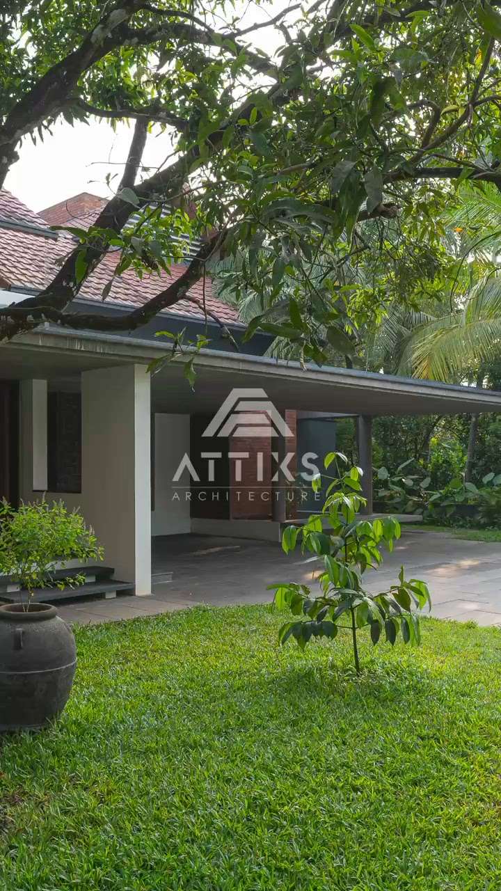 PAVILION HOUSE

Location: Ponnani, Kerala
Plot Area: 1 Acre
Built Up: 6950 sq.ft.
Start year: 2019
Completion: 2022

The main idea was to merge the built with in the landscape. As the building ages and trees grows, the built
and unbuilt will become more and more seamless.
The design response primarily to the context and brings
its essence with in. The central court is kept as the focus by the allure of red bricks representing the traditional nadumuttom. Area have been woven together to create seamless floor spaces with a few landscaped elements. The split-level renders better connectivity within the house, allowing private spaces
to overlook the central court. The Material palette is kept minimal, Kota stone flooring captures reflection and while exposed concrete ceiling add a rustic charm. Wooden flooring and the details bring in richness,
with white walls tying it all together. Courtyard have been designed to serve multiple functions, making the space flexible and multifunctional. Deck could occasionally turn into a gathering space / even a stage
during festive gathering which the client had expressed a need for early on, in their requirements.
Skylights were added to create interest within the space. A well-lit home, the house sufficiently lit in the
daytime with the light that comes in through skylight and slit windows eliminating the need for artificial