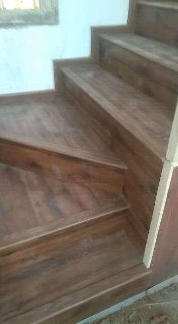 Wooden flooring installation work by Chetan interior