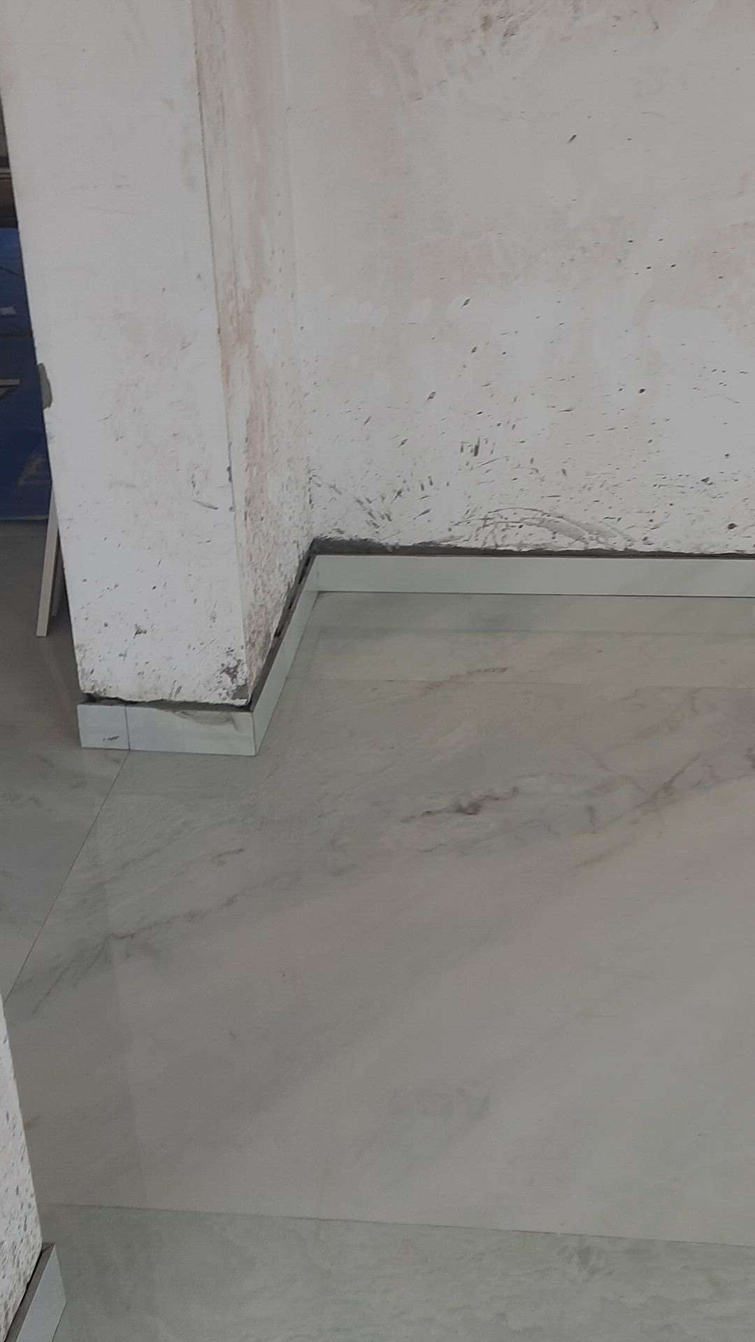 Living room floor tile work with premium quality simpolo slabs