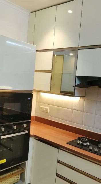modular kitchen designed in Noida 
 #ModularKitchen #WoodenKitchen #wood #KitchenCabinet #LShapeKitchen #ClosedKitchen #KitchenRenovation #KitchenCeilingDesign #KitchenTiles #KitchenInterior #OpenKitchnen