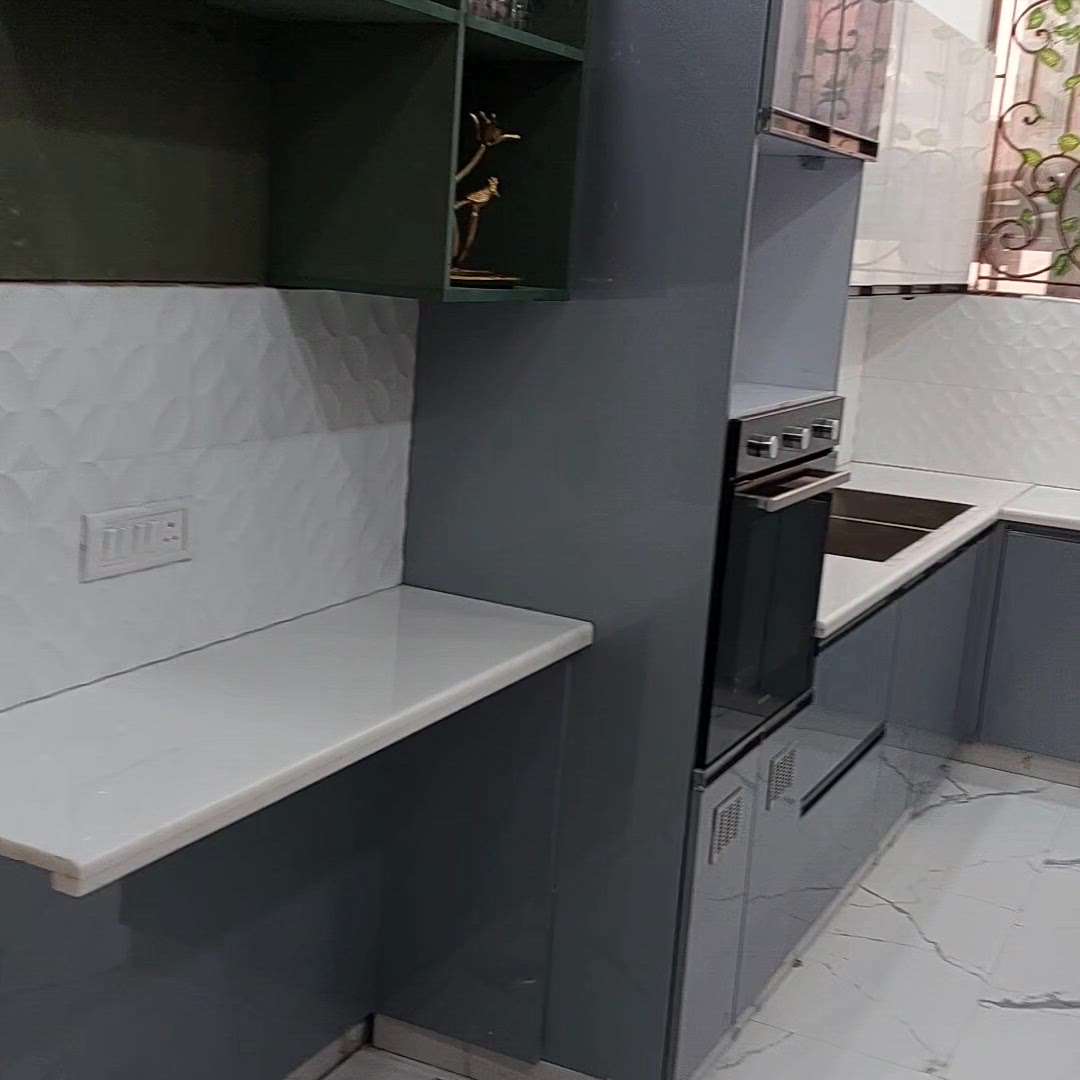 Modular kitchen by Rishi Home Interior