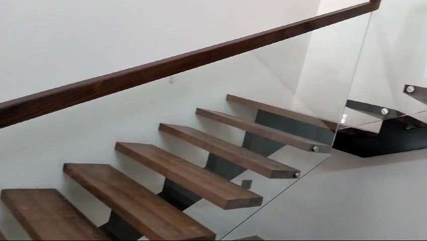 Steel Staircase, wood covered steps and glass handrail