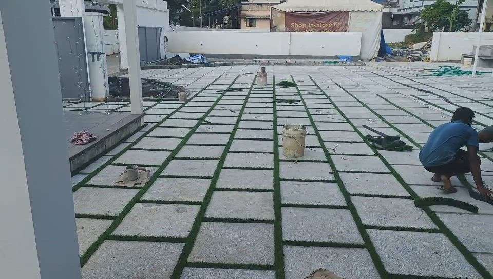 Paving stone with artificial grass finishing stage