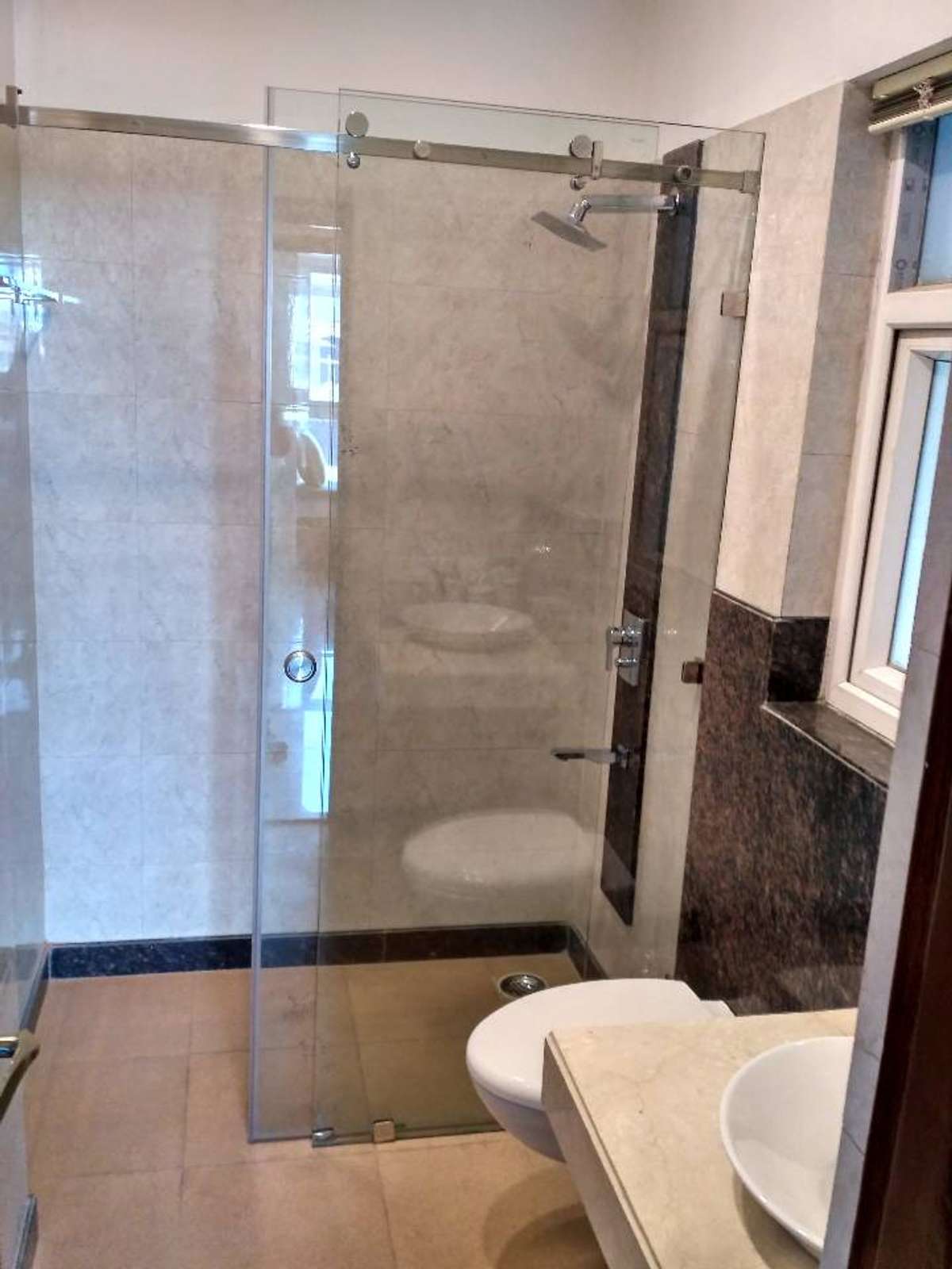 5feet by 7feet pipe sliding shower cubicle with 10mm clear toughened glass only in Rs 17000
