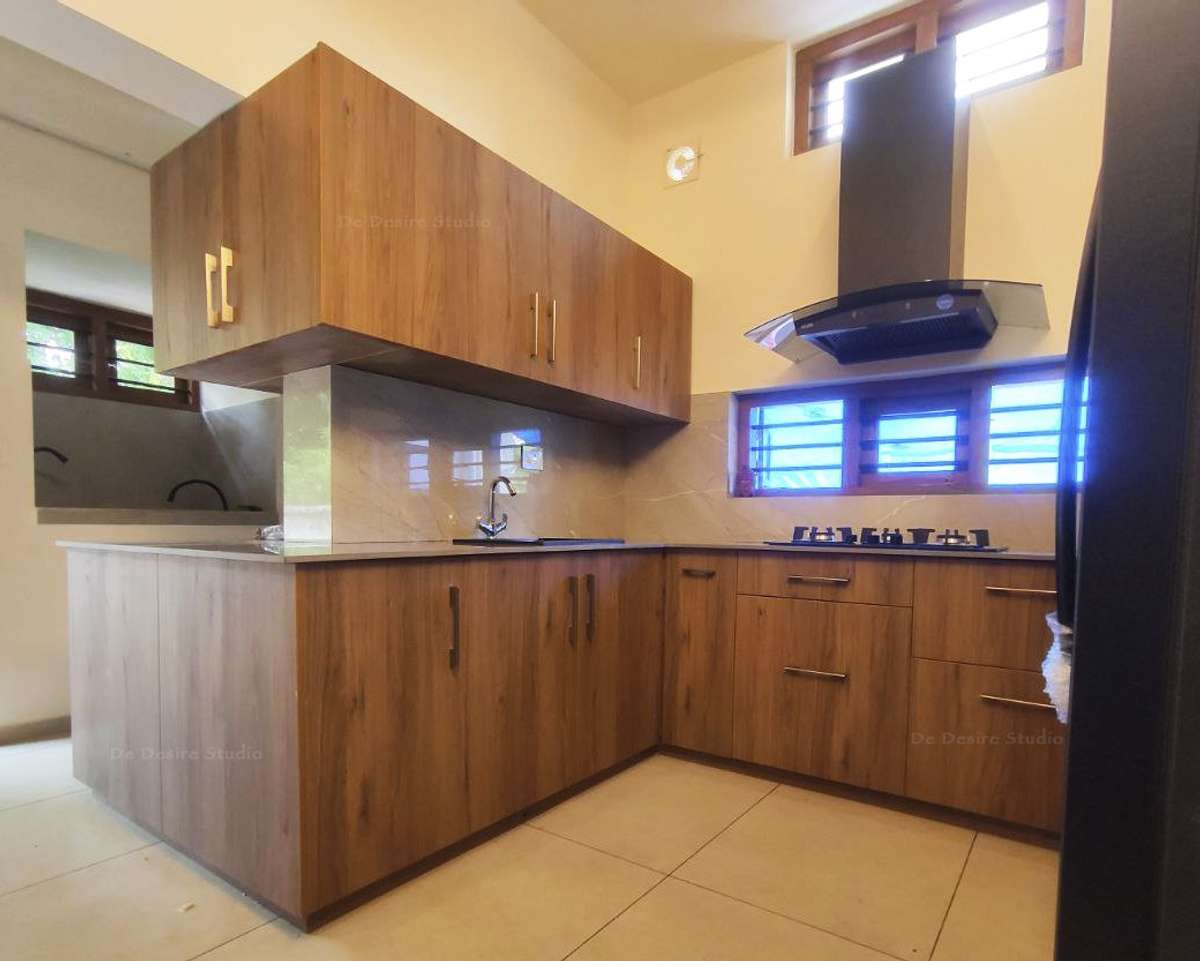 kitchen cupboard design can be wooden or other light and dark colour laminate. it's basically depends on plan 