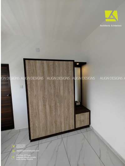 Completed Wardrobe with Dressing Unit
ALIGN DESIGNS 
Architects & Interiors
2nd floor,VF Tower
Edapally,Marottichuvadu
Kochi, Kerala - 682024
Phone: 9562657062