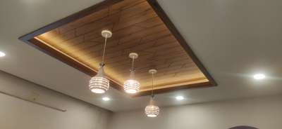 Gypsum ceiling with laminated wood design