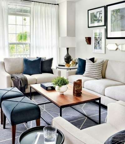 Cream and Blue make a great combination. Get this look with:plain cream sofas, cobalt blue cushions, a blue gray rug with geometric print, blue ottomans, a wall full of simple black and white frames, sheer white curtains, a lampshade, a sleek wooden and metal coffee table and a vase with plant in the centre.
#interior #decor #ideas #home #interiordesign #indian #colourful