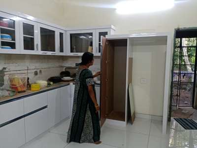 Inspecting final work of kitchen