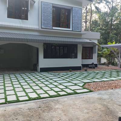 Landscaping: Natural stone (Banglore stone) with artificial grass along with pebble.