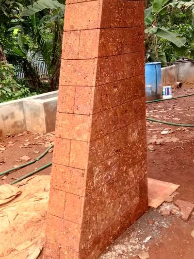 Piller works with Laterite Rad Stone Tiles.