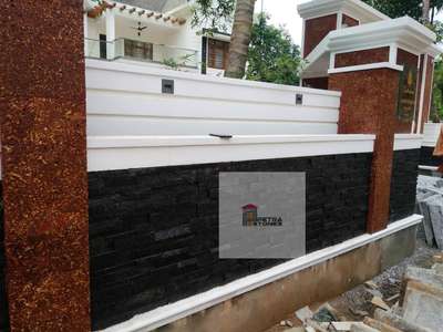 compound wall finishing with latrite stone and silver grey panel...

 #claddingstones #naturalstones #WallDesigns