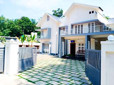 Shown is the design of the new house where the keys were handed over the previous day

#ContemporaryHouse #Alappuzha #Ernakulam #TRISSUR #Malappuram #Kozhikode #Idukki