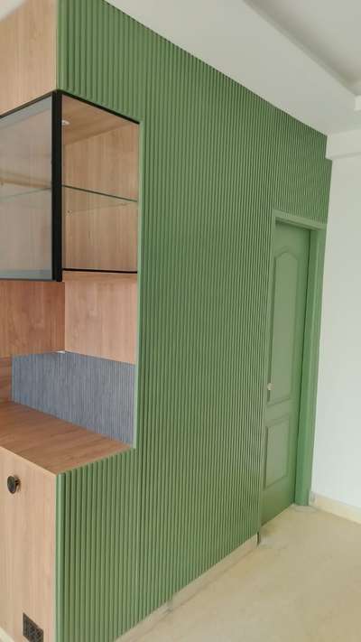 Flutting design on wall paneling  and sliding wardrobe and crockery unit .   #Interior_Work #ModularKitchen #modularwardrobe #paneling