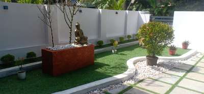 exterior garden with buddha sculpture  
artificial grass #exterior_Work #exteriordesigns #exteriordesing