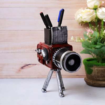 Add vintage charm to your workspace with this handcrafted resin vintage camera. Its distressed tripod base doubles as a stylish desk organizer for pens and more.
#AVintageAffair #vintagedecor #homedecor #vintage #giftingsolutions #giftingideas #gifting #tabledecor #kitchendecor #decorideas #partydecor #monsoonsale #sale #discount #seasonalsale #season #newarrivals #newcollection #decoraccents #cameratripod #camerapenstand #photographer #loveforphotography #decorshopping