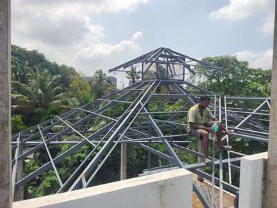 Site @ Edapally ..ongoing roof truss work. #RoofingIdeas  #GlassHandRailStaircase  #GlassStaircase  #canopy  #mswork  #StainlessSteelBalconyRailing  #steelrailing