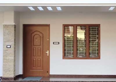 Embossing door 
design shell. E18
colour sunteak
and wood finish doub shutter casement window with fly mesh
please contact 9447870900
 #engineeringstudent  #CivilEngineer  #architecturedesigns  #Architectural&nterior  #architact  #HouseConstruction  #constructioncompany  #crowncazzio_building_design_and_construction  #BuildingSupplies  #Buildingconstruction  #Thrissur  #Palakkad  #Malappuram  #Ernakulam