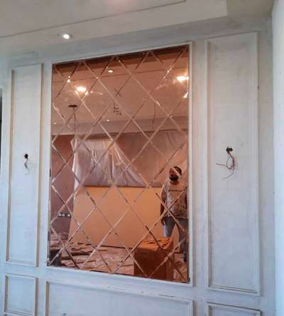 wall pannelling of rose gold glass