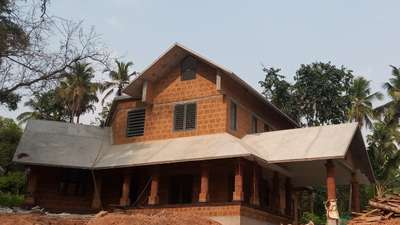 house with exposed laterite
nearing completion