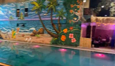 swimming pool with cafe at Delhi
