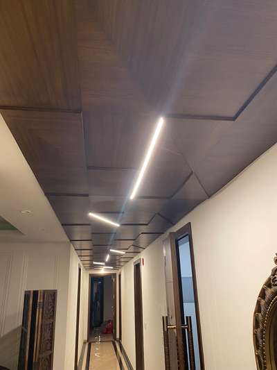 Customised ceilings @ South Ex 2  #WoodenCeiling  #profilelighting  #exclusivedesigns