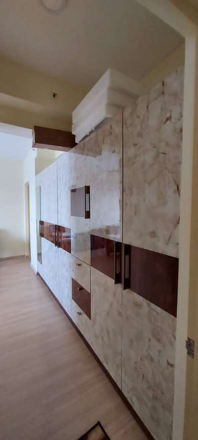 This project was completed for our cooperative client, Vinay, at DLF Apartments in Kakanad. It was a pleasure working with him. Featured here is a lengthy master wardrobe, carefully designed with cost-saving measures that exclude the loft.

9446444810