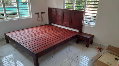 wooden cot with സൈഡ് table
