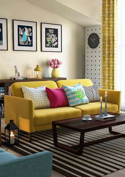 Add a touch of colour to your neutral living room with this yellow sofa, printed yellow curtains, lanterns and vases. Use a black wall clock, gray rug and frames to balance the colour pallette.
#interior #decor #ideas #home #interiordesign #indian #colourful #decorshopping