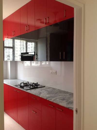 Indulging in Deep Tones: A Luxurious Dark Red and Black Kitchen Transformation at DLF, Tailored to Perfection