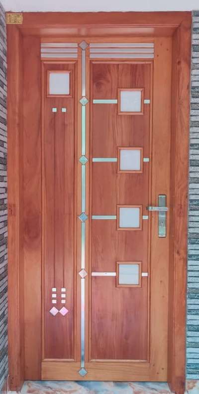 Anjili front door - 11000
#wodendoor  #Woodendoor  #woodenfinish  #wood  #woodenframes #GlassDoors  #DoorDesigns