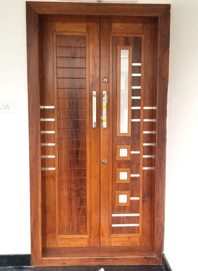 Teakwood main door  #thondutharayilfurnituremart  #woodenfurniture #contemporaryfurniture #teakwoodfurniture   #DoubleDoor  #ContemporaryHouse