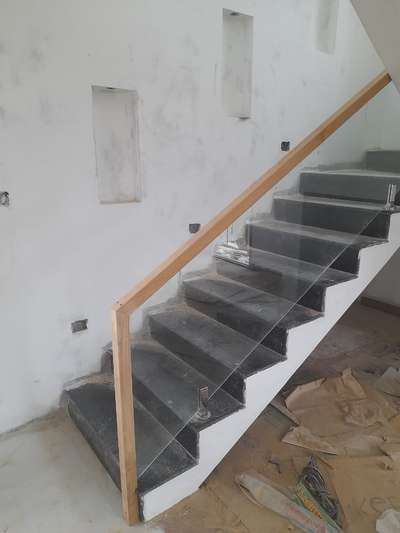 Full toughened glass, Teak wood top rail, Spigot Handrail and Balcony work completed at Kuttikkanam