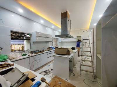 kitchen  # interior #multiwood #mica #islandchimney  #mica #walltiles  #CelingLights