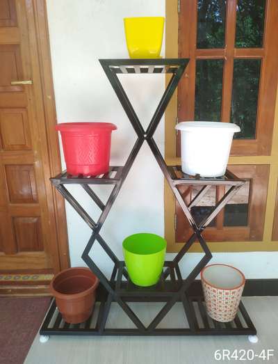 METAL STAND FOR INDOOR PLANTS. 
Durable, Eco friendly. Rest free, Not harmful for any floor, Adjustable legs for leveling.