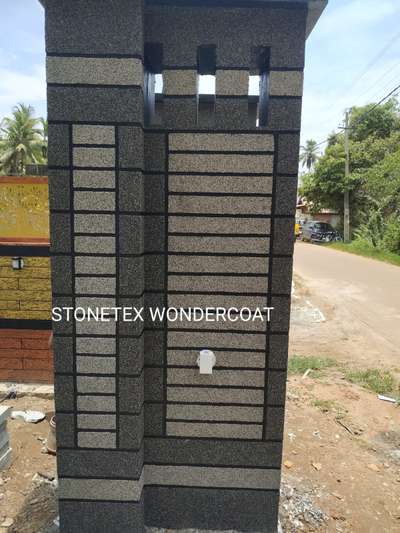 Adding a touch of natural beauty to the entrance of the property is made easy with this beautiful natural stone texture for the main gate pillar. This decorous design of the stone pillar will make the entrance look majestic and graceful. 
#naturalstone #stonepillar #majesticentrance #gracefuldesign
#texture #exteriors #exteriordesign #texturework #kerala #kollam #homeexterior #walltexture #art #stoneplaster #design #abstract #oachira #homedecor #texturepainting #texturepaint #pillar #keralahomedesign #keralamodel #photography #veedu #pillars