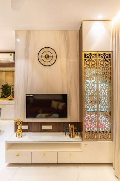 TV Unit With beautiful Mandir Designs You'll Love.Setting up a TV unit with a mandir is a convenient and innovative home design solution
#bhatiyainterior #modularkitchen #homerenovation #interiordesign #homedesignideas #mandir 
www.bhatiyainterior.com