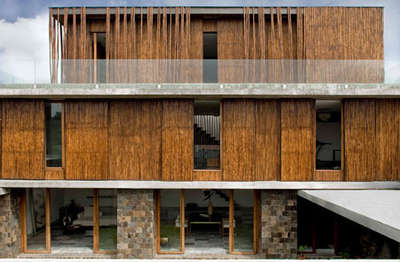 Family Residence at Parañaque, #Philippines
designed by Atelier Sacha Cotture

Bamboo poles were used to clad the facade and surrounding walls of this house. The central #courtyard to restrict views of the #interior from adjacent properties. 
"The courtyard solution has been chosen for its qualities of #efficiency and #privacy," said the #architects. 
Explaining the choice of #bamboo, the architects said: "It is a low cost and #sustainable material that grows intensively locally


#WorldArchitecture #AtelierSachaCotture #Parañaque #EnergyEfficient #LocalMaterials #EcoFriendly