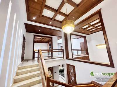 The residence  in Pavaratty, Kerala showcases classic luxury  within  its elegantly  exterior.
The client  wanted a classic elegant yet functional home where cross ventilation  and maintenance  of privacy were to play a vital role.The wooden interior  crafts a luxury look into the facade .While keeping things elegant,  simple,functional and practical .The interior injects enough style using handpicked  quality accessories. The piece of resistance is the flamboyantly designed  green courtyard that sits in the center of the house, illuminated  by the natural sunlight  received  from the overhead skylight. Some of the amenities  include  gazebo, patio, landscaping, interiors designed and advanced security installation. 

Area : 6500sqft
Client : Nisumon
Architect : Fairooz
Interior design and execution :  ECOSCAPE architecture interior innovation, Pavaratty 
Mob - 9633070602,7593911213



Please contact  us: Email: ecoscapepvt@gmail.com 
Follow us on 
Youtube : https://youtube.com/user/ju