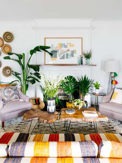 Create this Boho style living room with multiple layers by using wooden nesting table, boho cushions, wall baskets, vases and a floor lamp.
#interior #decor #ideas #home #interiordesign #indian #colourful #decorshopping