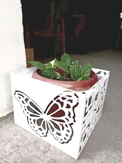 Flower pot with four side, different designs.