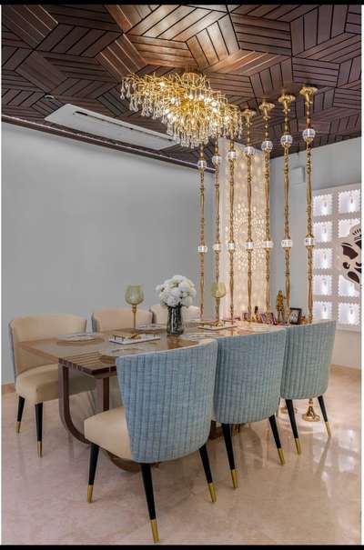 Dining space with exclusive wooden false ceiling and a partition created to separate pooja room. 

Follow for more design and work
  #FalseCeiling 
 #DiningChairs  #HouseDesigns  #RectangularDiningTable  #partitions  #chandelier  #Poojaroom  #poojaroomdesign