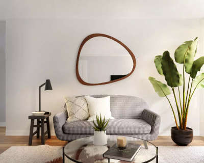 Design this modern living room with a dark grey and white small checkered sofa ,a curvy accent mirror on the wall,a large potted plant in the corner, a black curved table lamp and an off white woven rug on the floor which gives an overall impression of minimalism and simplicity.#interior #decor #ideas #home #interiordesign #indian #colourful#decorshopping