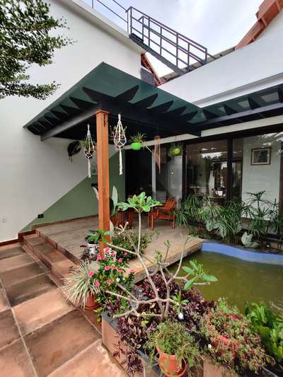 Patio space
#architecturedesigns #patio #waterbody #ContemporaryHouse #sloperoof #Architect #Kollam