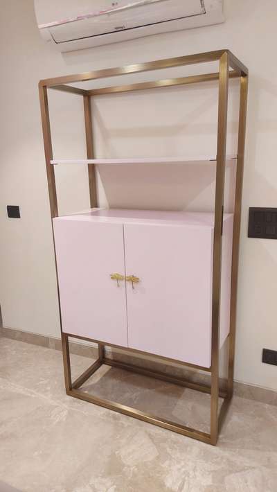 Light pink book shelf with antique gold electroplating and high gloss pu .like and comment for more updates.  #Delhihome  #delhiinteriordesigner  #delhifurniture  #beutifulhome  #noidainterior