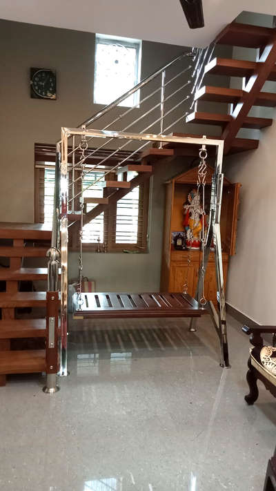 #ModernHangingSwing and Steel staircase with custom solid wood steps Work completed by us