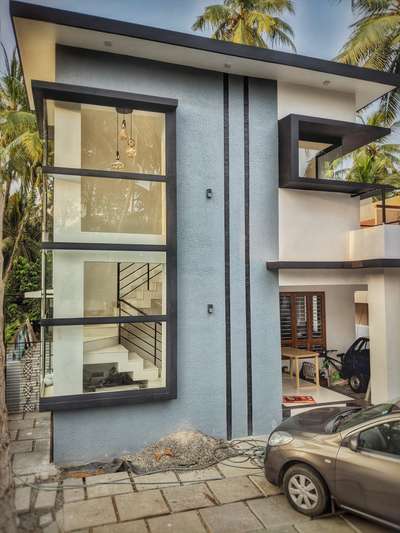 #ContemporaryHouse #boxtypehouse #GlassStaircase #glass #modernhome #KeralaStyleHouse #keralaarchitecture #trivandrum #Thiruvananthapuram #keralastyle #SandStone