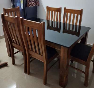 Teakwood Dining table 9500
Chairs 1900.
table size 5x3
12 mm black glass top 
#DiningChairs #DiningTable #furniture  #keralastyle